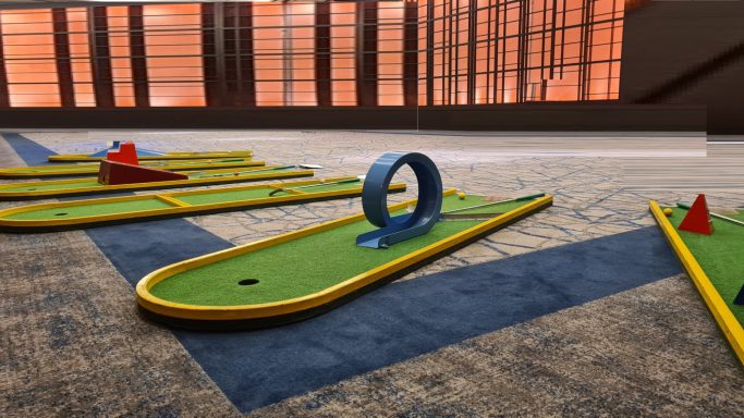 Minigolf - Minigolfbahnen Minigolfplatz mit verschiedenen Hindernissen, darunter ein Ring und geometrische Formen.
